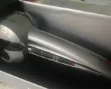 Srebrna lokówka automatyczna BaByliss Pro MiraCurl w pudełku.